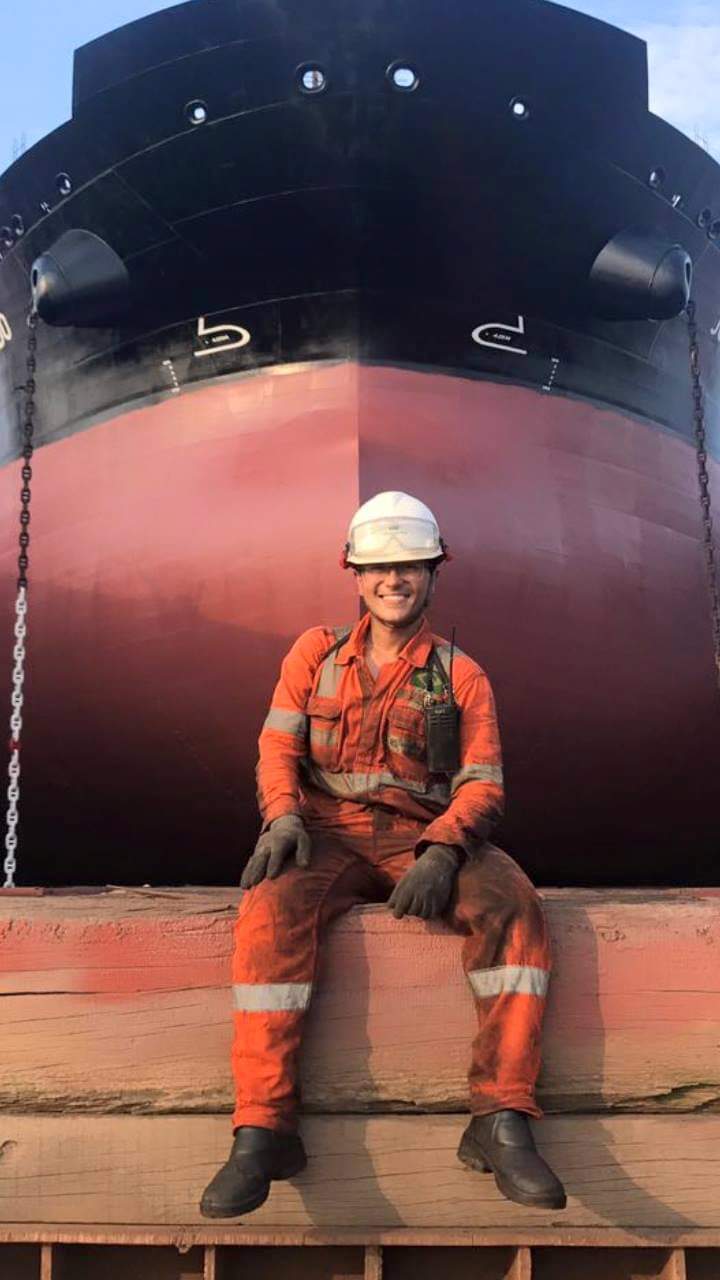 Seafarer Matheus Oliveria Bernardes Costa in front of chemical tanker Flumar Brasil