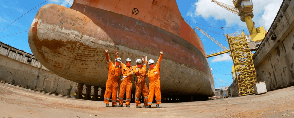 Officers in front of chemical tanker Flumar Maceio | Odfjell