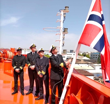 Bow Optima Captain hoises the flag onboard for the first time