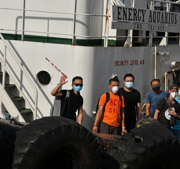 Seafarers disembark Odfjell&#039;s chemical tanker Bow Sun after the ship was rerouted to Manila for the sole purpose of facilitating crew changes during the Covid-19 pandemic. 